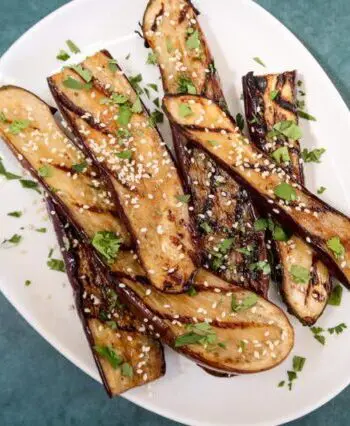 grilled chinese eggplant with sesame seeds garnish