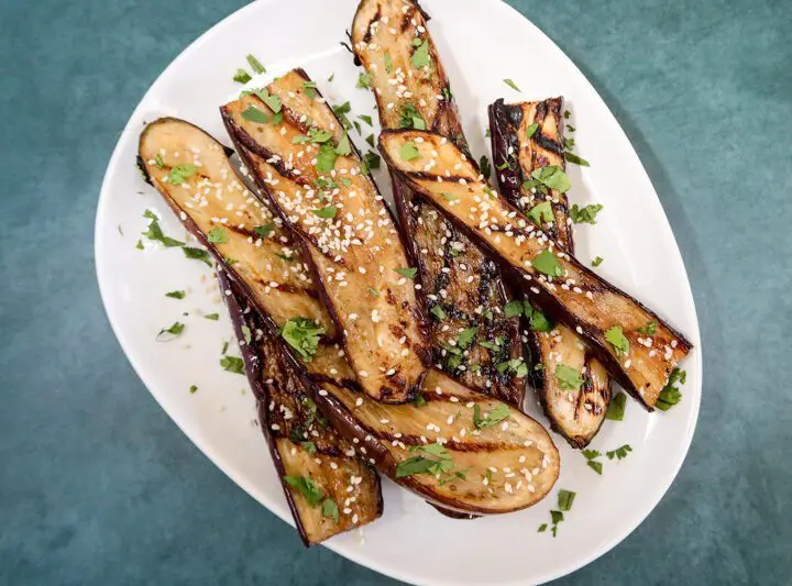 grilled chinese eggplant with sesame seeds garnish