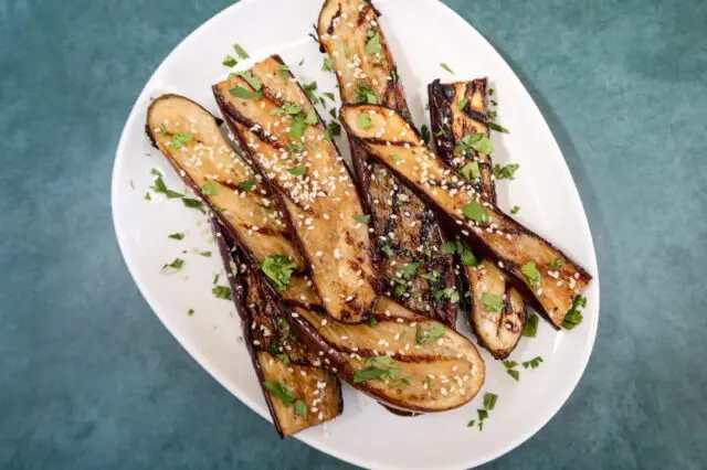 grilled chinese eggplant with sesame seeds garnish