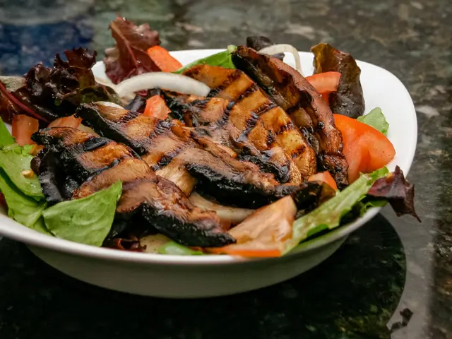 grilled mushrooms on a salad