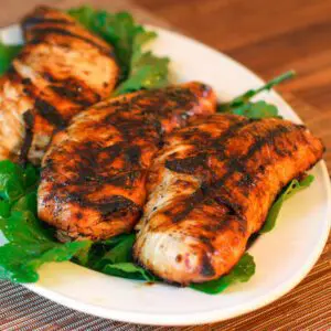 marinated grilled turkey tenderloins on a platter