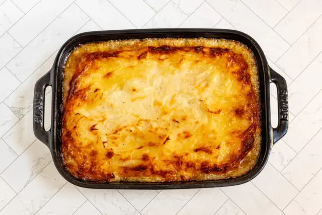 Baked ground beef casserole with mashed potato topping.