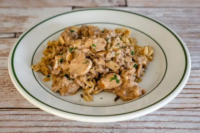 ground beef stroganoff over rice with sour cream sauce and mushrooms