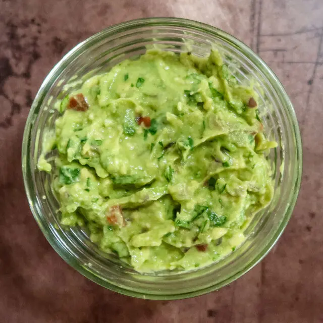 Fresh guacamole in a small bowl.