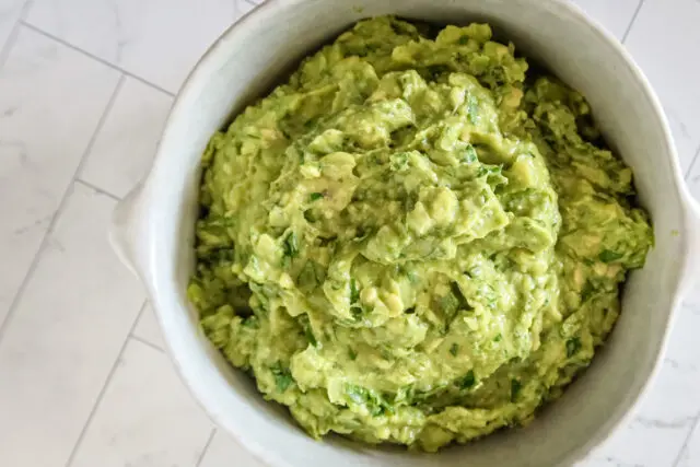 A bowl of creamy homemade guacamole.