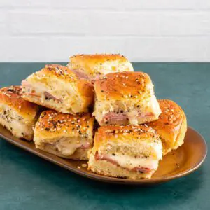 ham and cheese sliders on a serving plate