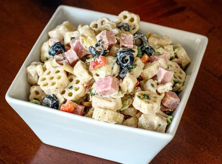 pasta salad with marinated artichokes, ham, and olives