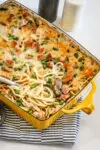 Ham tetrazzini in the baking dish being served.