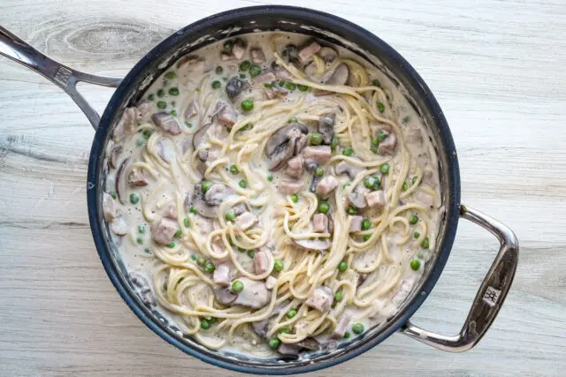 The spaghetti is combined with the ham and mushroom sauce mixture to make a ham tetrazzini casserole.