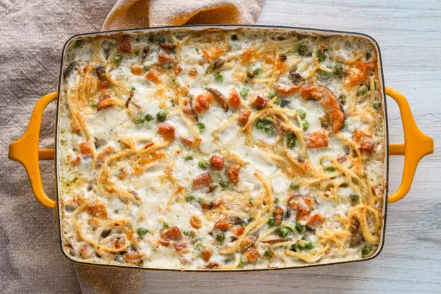 Freshly baked ham tetrazzini in a Dansk baking dish.