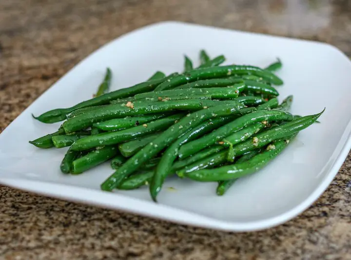 haricot verts with garlic on a serving plate