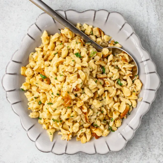 A plate of homemade spaetzle sautéed with butter.