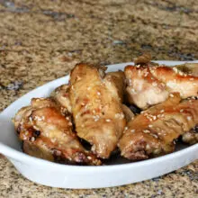 honey garlic chicken wings on a serving plate