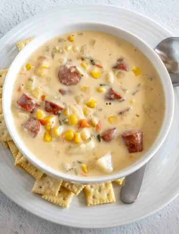 hot dog chowder in a bowl with mini saltine crackers on the side