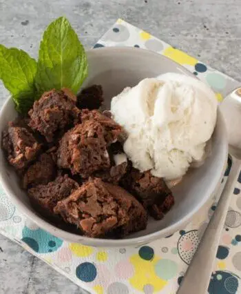 hot fudge cake cut into squares and served with vanilla ice cream