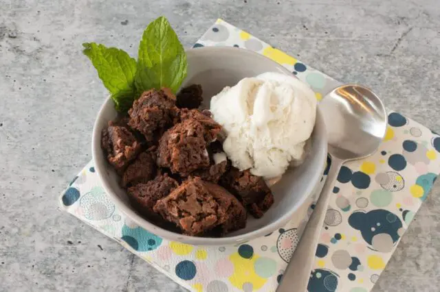 hot fudge cake cut into squares and served with vanilla ice cream