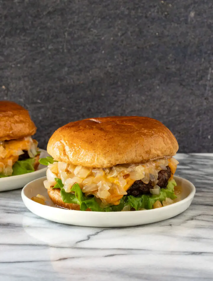 A delicious, buttery Wisconsin butter burger with sauteed onions, lettuce, and cheese.