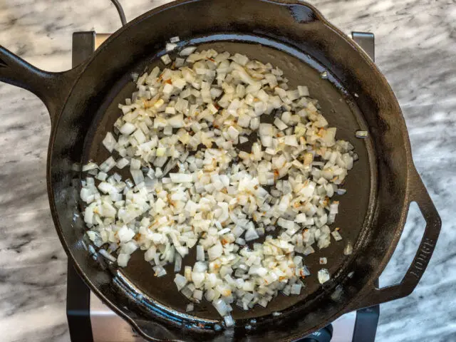 Frying the onions for the butter burgers.