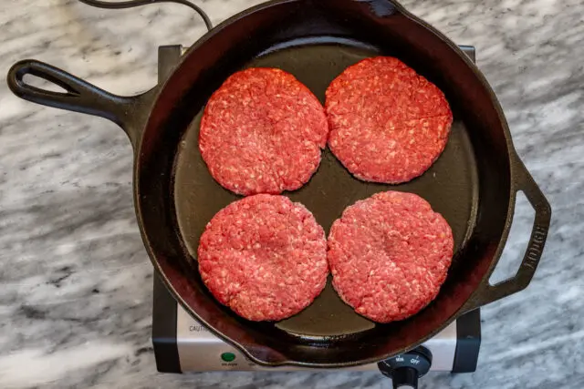 Butter burger prep; frying the burger patties.