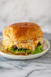 A Wisconsin butter burger with cheese, onions, and lettuce.