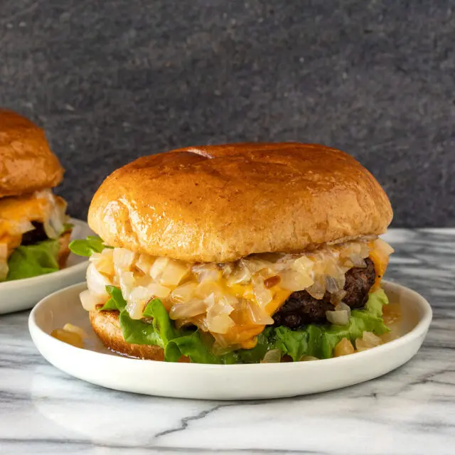 A delicious, buttery Wisconsin butter burger with sauteed onions, lettuce, and cheese.