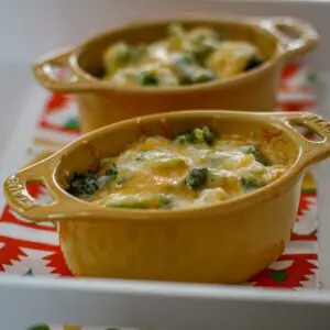 2 broccoli, rice, and cheese casseroles in ramekins