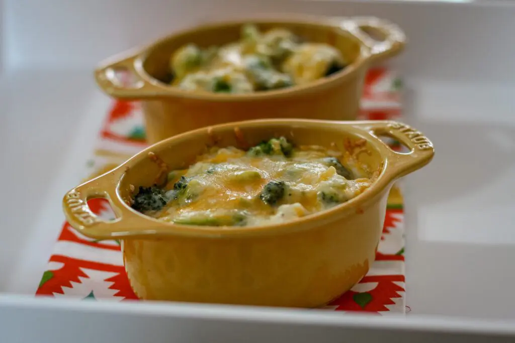 cocottes with broccoli rice and cheese mixture, baked
