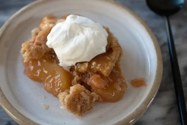 spoon the dump cake into dessert dishes and top with ice cream or a dollop of freshly whipped cream