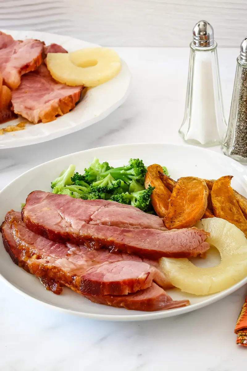 Glazing the Instant Pot ham for a quick finish in the oven.