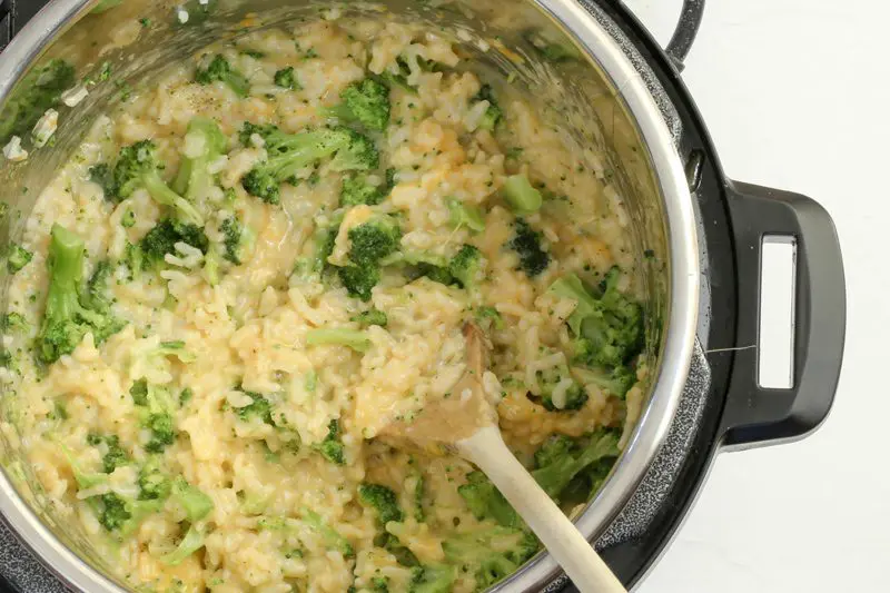 preparing broccoli and cheese rice in the instant pot pressure cooker