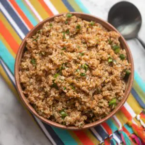 instant pot bulgur pilaf in a bowl with spoon