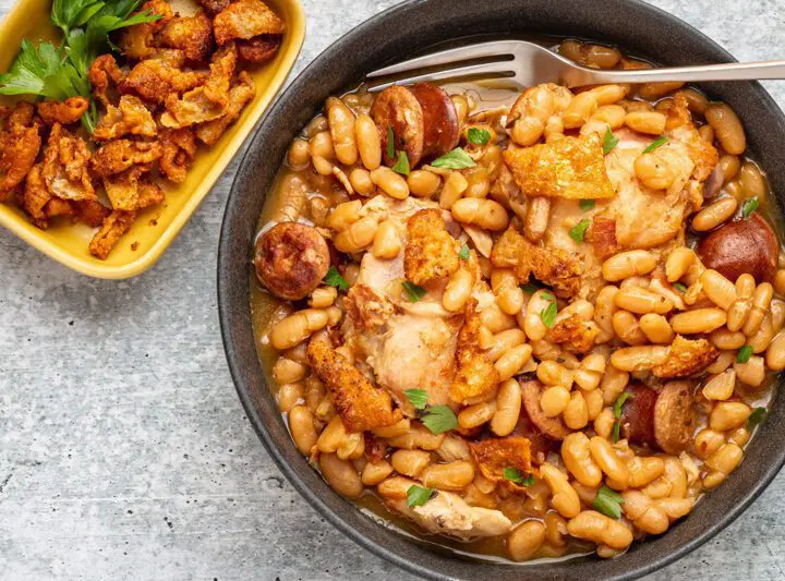 instant pot cassoulet with beans, chicken thighs, bacon, and smoked sausage