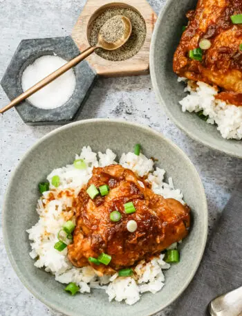 Overhead shot of Instant Pot chicken adobo with scallion garnish and shown on rice.