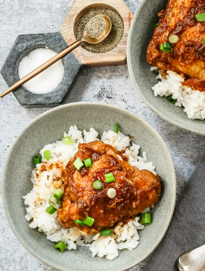 Overhead shot of Instant Pot chicken adobo with scallion garnish and shown on rice.