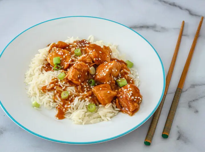 Instant Pot General Tso's chicken with sesame seeds over rice