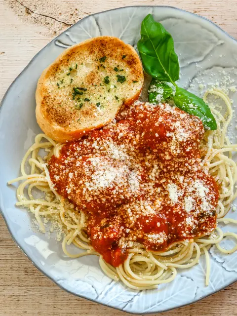 Meatballs and sauce cooked in the Instant Pot, on pasta.