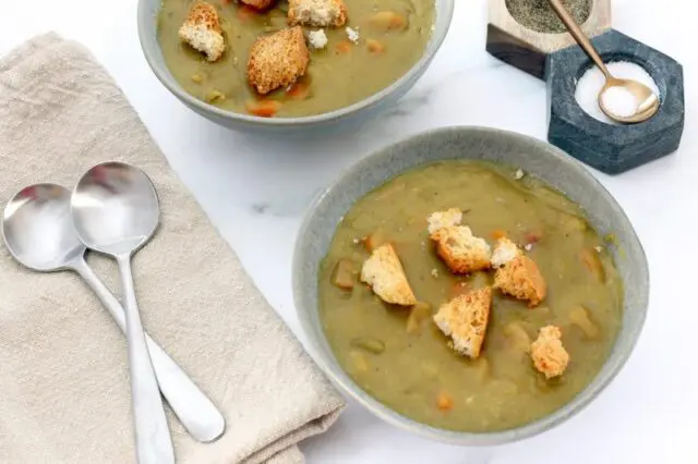 instant pot pea soup in bowls with croutons