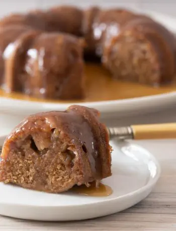 instant pot pear cake, sliced with the whole cake in the background