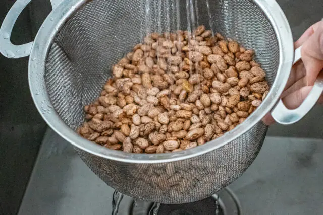 Rinsing the pinto beans for Instant Pot baked beans.