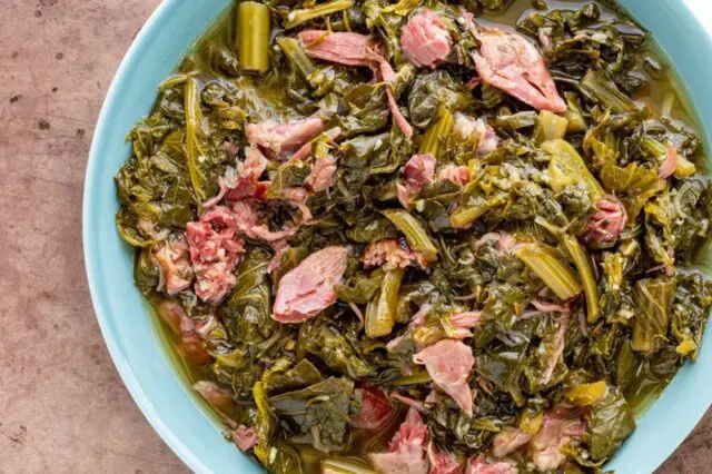 closeup of instant pot greens and shredded ham hock