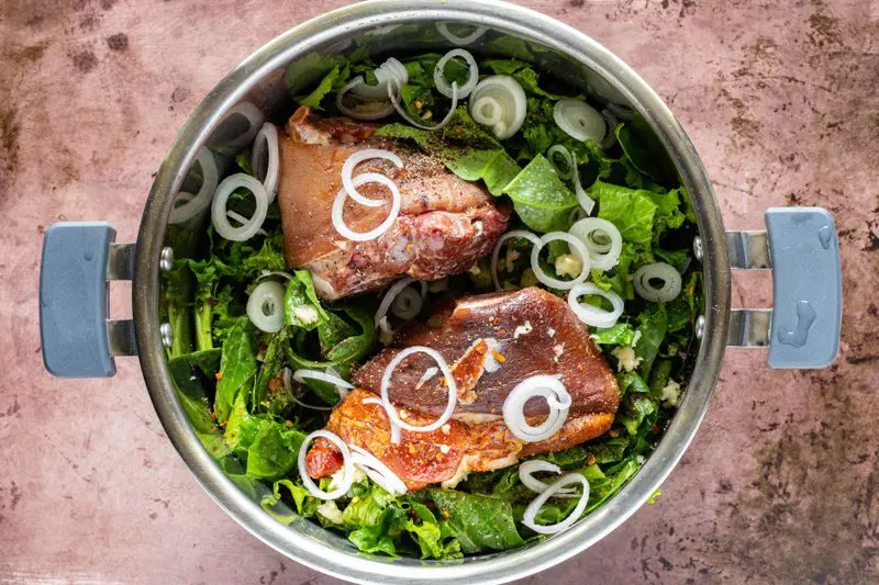Add the greens and ham hocks to the instant pot