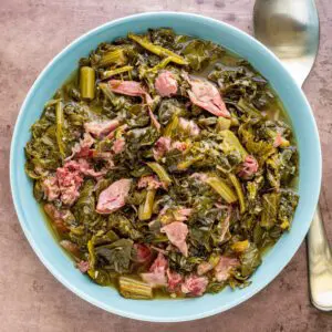 bowl of southern greens with shredded ham hock