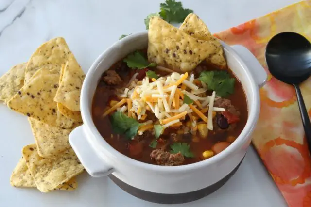 instant pot taco soup with tortilla chops and cheese