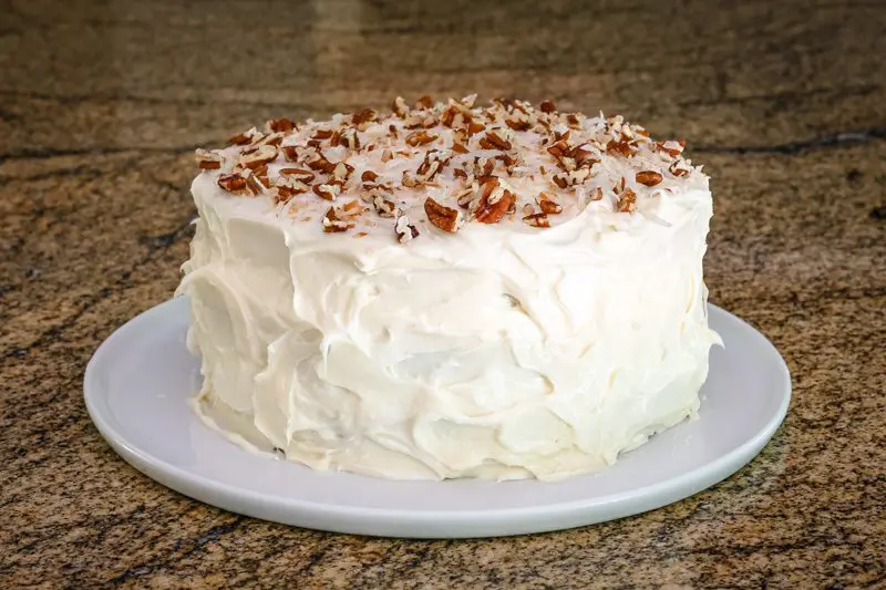 italian cream cake with cream cheese frosting and coconut and pecans