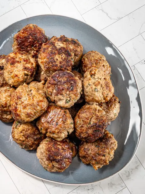 A serving plate with Italian meatballs.