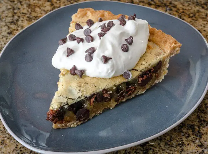 kentucky derby pie with chocolate cips and a whipped cream topping