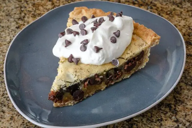 kentucky derby pie with chocolate cips and a whipped cream topping