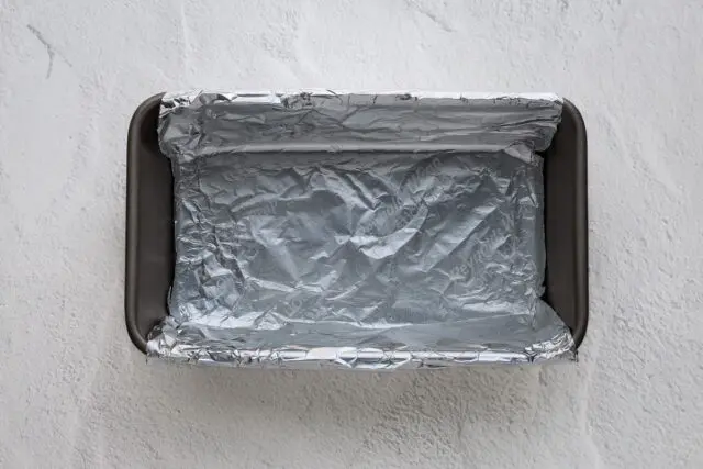 Line a 9-by-5-inch loaf pan with foil and spray with cooking spray.