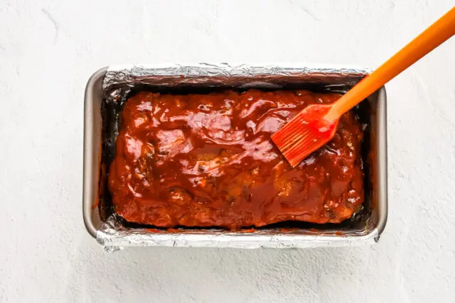 The partially cooked Korean meatloaf is glazed with gochujang mixture and returned to the oven.