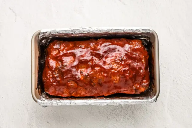 Korean meatloaf cooling on a rack.